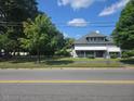 Inviting two-story home with mature trees, visible from a street view at 500 W Main St, Benson, NC 27504