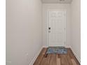 Bright foyer featuring wood-look flooring and a neutral color palette at 5430 Crescent Square St, Raleigh, NC 27616