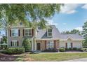 Charming two-story home with red shutters and landscaped yard at 9530 Vira Dr, Raleigh, NC 27617