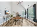 Bright home office with vaulted ceiling, wood floors, and a large window with natural light at 9530 Vira Dr, Raleigh, NC 27617
