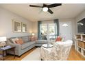 Comfortable living room with a stylish sofa, patterned chairs, and ample natural light at 103 Westview # H, Carrboro, NC 27510