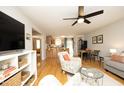 Open-concept living space seamlessly connects the living room, dining area, and kitchen at 103 Westview # H, Carrboro, NC 27510