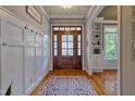 Spacious foyer with hardwood floors, coat hooks, a decorative rug, and ample natural light at 1161 Golden Star Way, Wake Forest, NC 27587