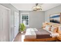 Cozy bedroom featuring natural light, neutral decor, and a modern ceiling fan at 117 Brierridge Dr, Apex, NC 27502