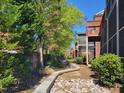 Secluded backyard view with lush greenery, a small stream, and mature trees at 129 Grande Dr, Morrisville, NC 27560