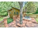 Large wooden deck with outdoor dining area offers gorgeous views and plenty of space to entertain at 36 Birnamwood Dr, Chapel Hill, NC 27516