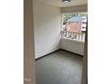 Enclosed balcony area with view of neighboring building at 3601 Helix Ct # 301, Raleigh, NC 27606