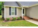 Close up of a home's front entrance with brick stairs and detailed trim adding to the home's curb appeal at 4524 Sugar Maple Rd, Oxford, NC 27565