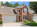 Charming two-story home featuring a combination of brick and stone facade, plus a two-car garage at 4724 Ludwell Branch Ct, Raleigh, NC 27612
