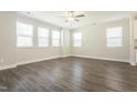 Bright and airy living room with hardwood floors, recessed lighting, and a modern ceiling fan at 5334 River Reach Dr, Raleigh, NC 27616