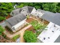 Birds eye view of sprawling property with stone and gravel paths through the green spaces at 708 October Woods Rd, Chapel Hill, NC 27516