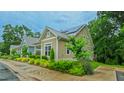 Well-maintained home with a metal roof, solar panels and a beautifully landscaped yard at 729 Lorentello Cir, Hillsborough, NC 27278
