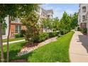 Well-manicured lawn and landscaped grounds surrounding the townhomes at 10310 Sablewood Dr # 111, Raleigh, NC 27617