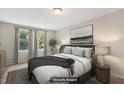 Bright bedroom features a comfortable bed, natural light from windows, and tasteful decor at 104 Benedict Ln, Raleigh, NC 27614