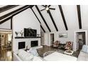 Spacious living room with vaulted ceilings, a brick fireplace, and hardwood floors at 105 Litchfield Ct, Rocky Mount, NC 27803