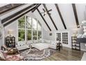 Bright living room with a large window, vaulted ceilings, and hardwood floors at 105 Litchfield Ct, Rocky Mount, NC 27803