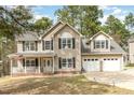 Charming two-story home featuring a covered front porch and a two-car garage at 216 Captain Harbor Hbr, Sanford, NC 27332