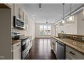 Spacious kitchen with stainless appliances, granite countertops, and ample lighting at 300 Finsbury St # 309, Durham, NC 27703