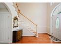 Spacious foyer with hardwood floors, natural light, and staircase at 3021 Glenwood Dr, Durham, NC 27705
