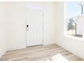 Inviting entryway with natural light, showcasing modern flooring and a clean design at 425 Hipwood Dr, Zebulon, NC 27597