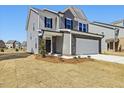 Stylish two-story home featuring a well-maintained lawn and appealing curb appeal at 425 Hipwood Dr, Zebulon, NC 27597