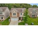 An elevated view shows this beautiful home with manicured lawn and mature trees in a well-maintained neighborhood at 542 Spaulding St, Burlington, NC 27215