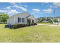 Well-kept lawn with a charming one-story home and attached garage, perfect for curb appeal at 6 N Carolina Ave, Benson, NC 27504
