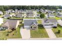 A high angle view reveals a home with a driveway and lawn nestled within a residential neighborhood at 6920 Moss Creek Way, Rocky Mount, NC 27804