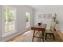 Bright office space featuring hardwood floors, natural light, and neutral walls at 9425 Brimstone Ln, Raleigh, NC 27613