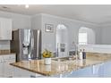 Kitchen island features granite countertops and stainless steel sink, perfect for cooking and entertaining at 110 Bray Dr, Mebane, NC 27302