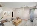 Inviting living room showcasing neutral paint, new floors, and lots of natural light at 118 Rhum Pl, Garner, NC 27529