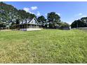 Attractive home boasting a wide porch, large grassy yard, and a storage shed at 1283 Ennis Rd, Angier, NC 27501
