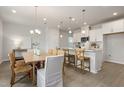 Beautiful kitchen featuring an island, stainless appliances, and a nearby dining area at 1525 Tamarisk Ln, Durham, NC 27703