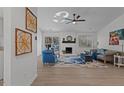 Bright living room with modern fireplace, hardwood floors, and sliding door access to a deck at 1536 Maybrook Dr, Raleigh, NC 27610