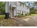 A charming two-story home with light blue siding, brown shutters, and a welcoming front entrance at 1824 Vintage Rd, Raleigh, NC 27610