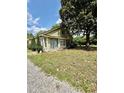 Cozy home with large windows, set on a lot featuring mature trees and gravel path at 304 Sandalwood Ave, Louisburg, NC 27549