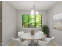 Cozy dining room featuring a round table with comfortable seating and a view of nature at 3088 Colony Rd # A, Durham, NC 27705
