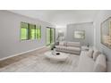 Inviting living room with modern furniture, natural light, and access to the dining area at 3088 Colony Rd # A, Durham, NC 27705