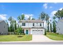 Beautiful two-story home with a well-kept lawn, a two-car garage, and a pleasant, manicured landscape at 31 Pascoli Ct, Clayton, NC 27527