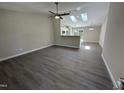 Bright and spacious living room boasts hardwood flooring and ample natural light at 311 W Market St, Graham, NC 27253