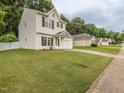 Charming home featuring a manicured lawn and an attached garage, located in a desirable neighborhood at 4020 Mindspring Dr, Raleigh, NC 27610