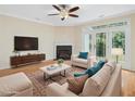 Inviting living room with a fireplace, complemented by hardwood floors and doors leading to the outside at 4719 Altha St, Raleigh, NC 27606
