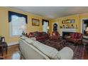 Cozy living room with a fireplace and hardwood floors at 1110 Edgewood Ave, Burlington, NC 27215