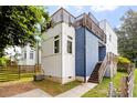 Modern home with rooftop deck, blue siding, and well-maintained landscaping at 1314 S East St, Raleigh, NC 27601
