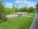 Aerial view of a fenced community dog park with green space at 380 Chesapeake Commons St # 129, Garner, NC 27529