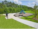 Community playground with a slide and climbing structure surrounded by benches at 380 Chesapeake Commons St # 129, Garner, NC 27529