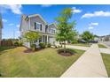 Beautiful two-story home with manicured lawn, healthy landscaping, and a driveway leading to an attached garage at 4508 Valley Crest Ln, Fuquay Varina, NC 27526