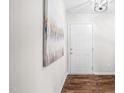 Bright entryway featuring hardwood floors, fresh paint, and stylish decor, welcoming you into a lovely home at 5 Windsor Pl, Mebane, NC 27302