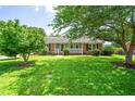 Beautiful ranch-style house featuring a well-maintained lawn and welcoming front porch, perfect for relaxing outdoors at 5 Windsor Pl, Mebane, NC 27302