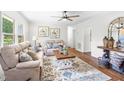 Inviting living room with cozy seating, a decorative rug, and ample natural light, perfect for relaxation at 5 Windsor Pl, Mebane, NC 27302